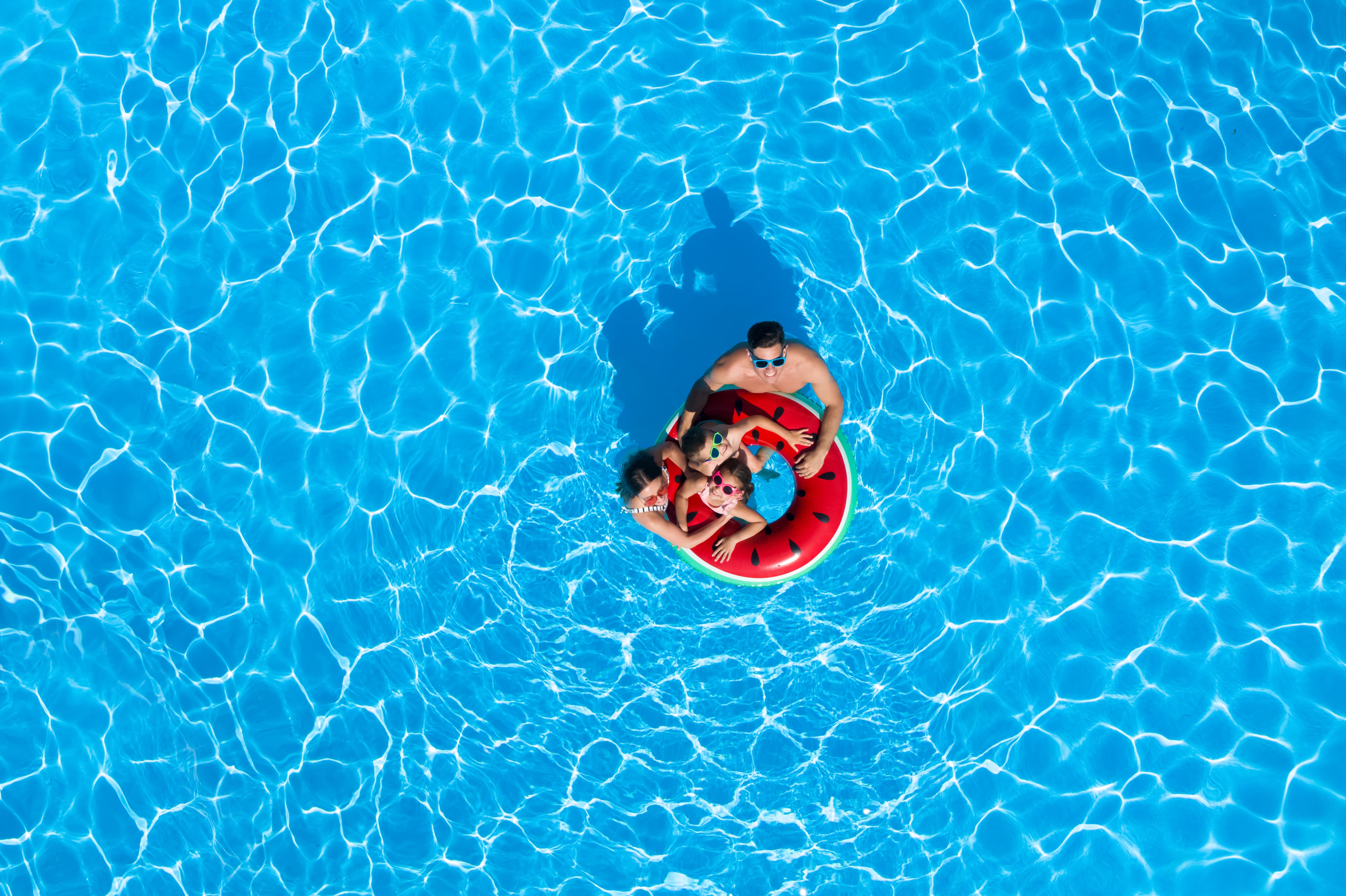 Family In Pool Getty (1)